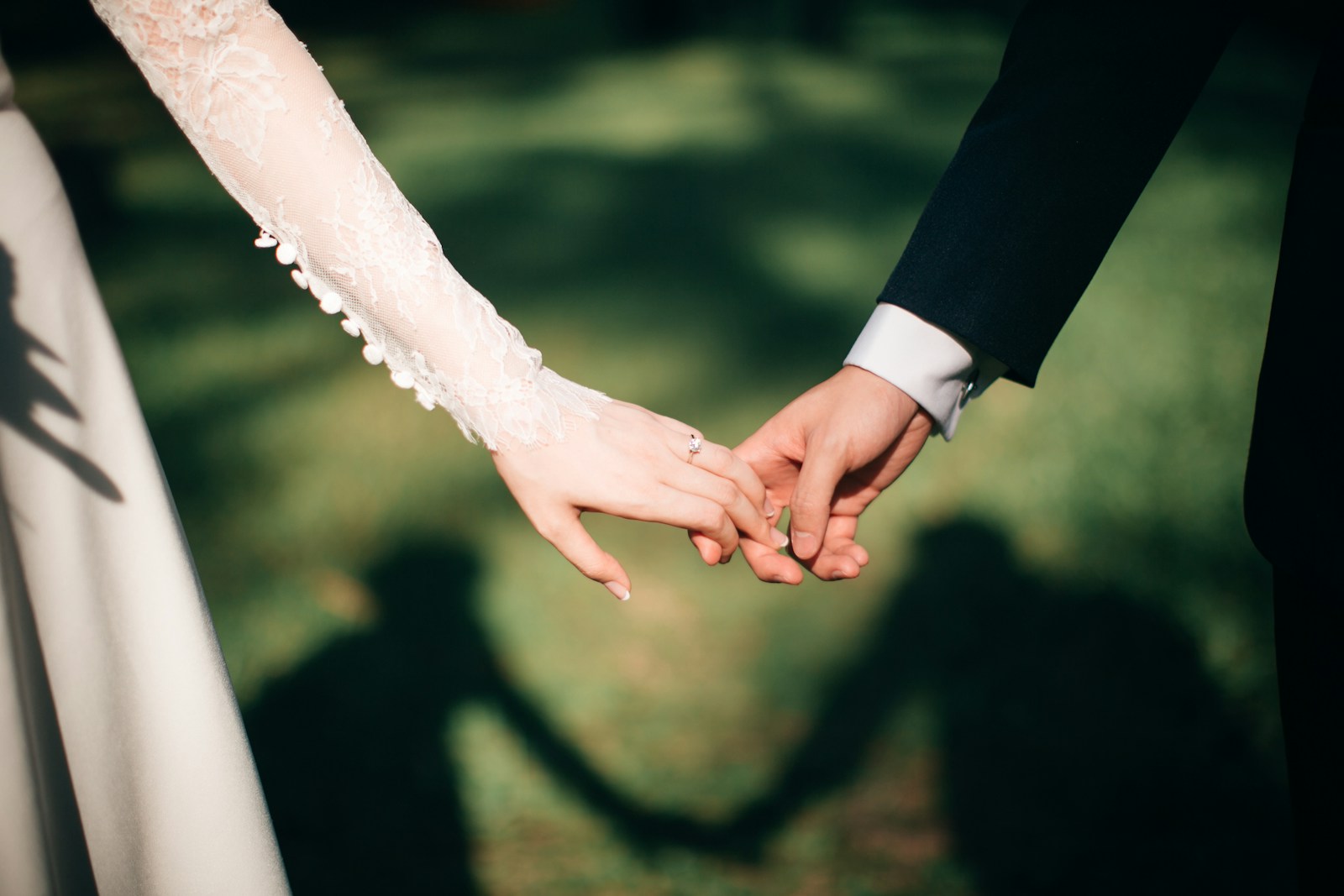 What Are the Creative Ways to Capture Wedding Memories? 1 man and woman holding hands focus photo