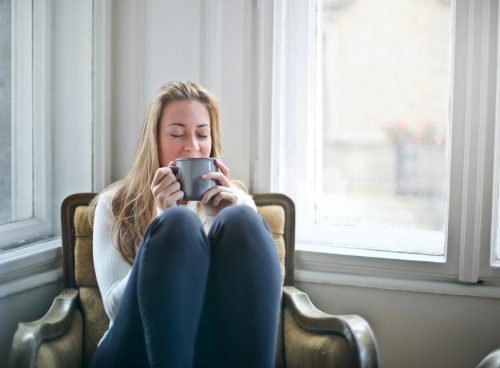 Woman Holding Gray Ceramic Mug
