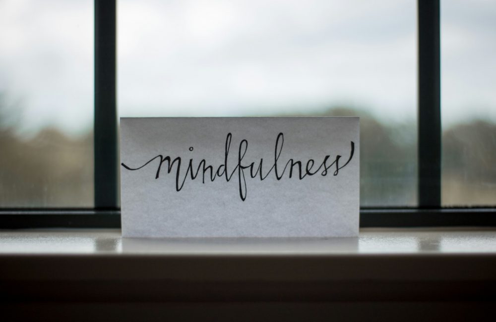 mindfulness printed paper near window