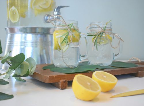 a couple of lemons sitting on top of a cutting board