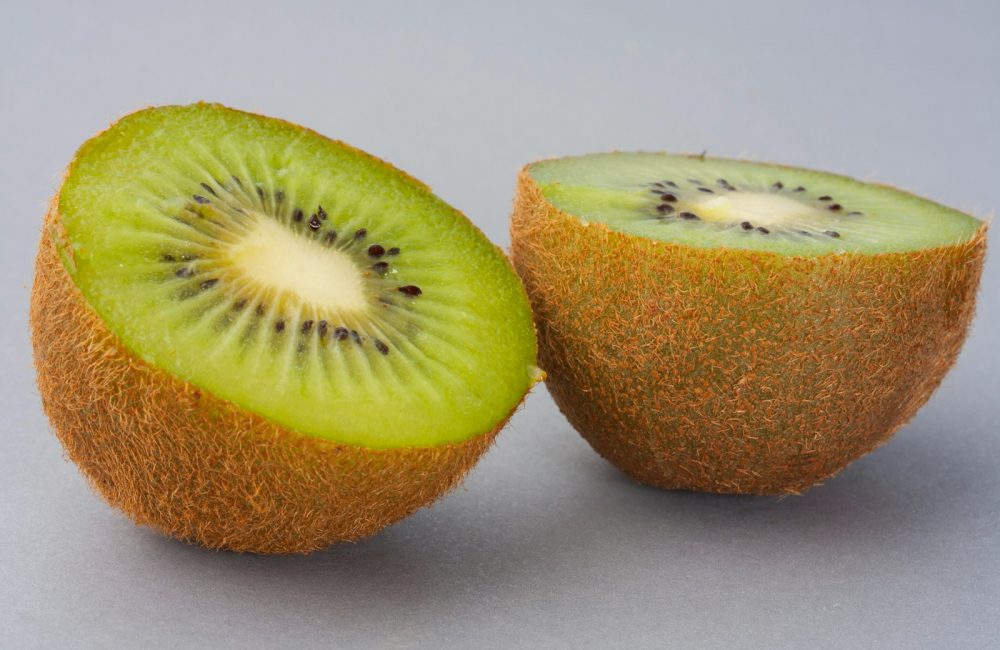 sliced green fruit on white surface