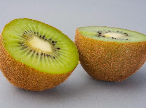 sliced green fruit on white surface