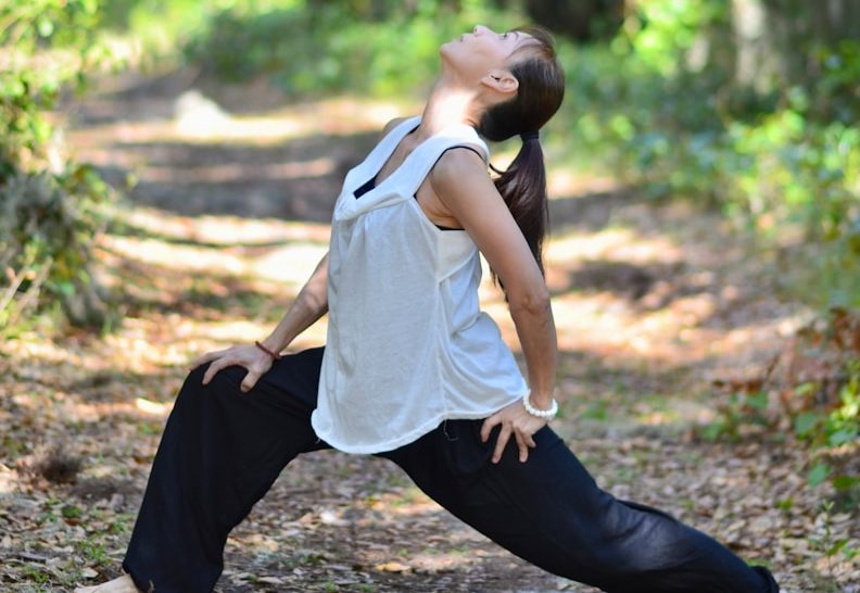 Is practicing qigong beneficial for mental health? 1 a woman is doing yoga in the woods