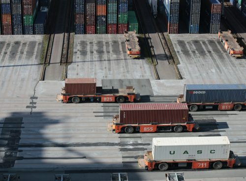 white and red truck on road during daytime