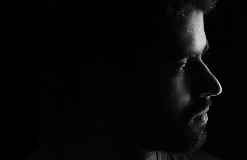 mans face in grayscale