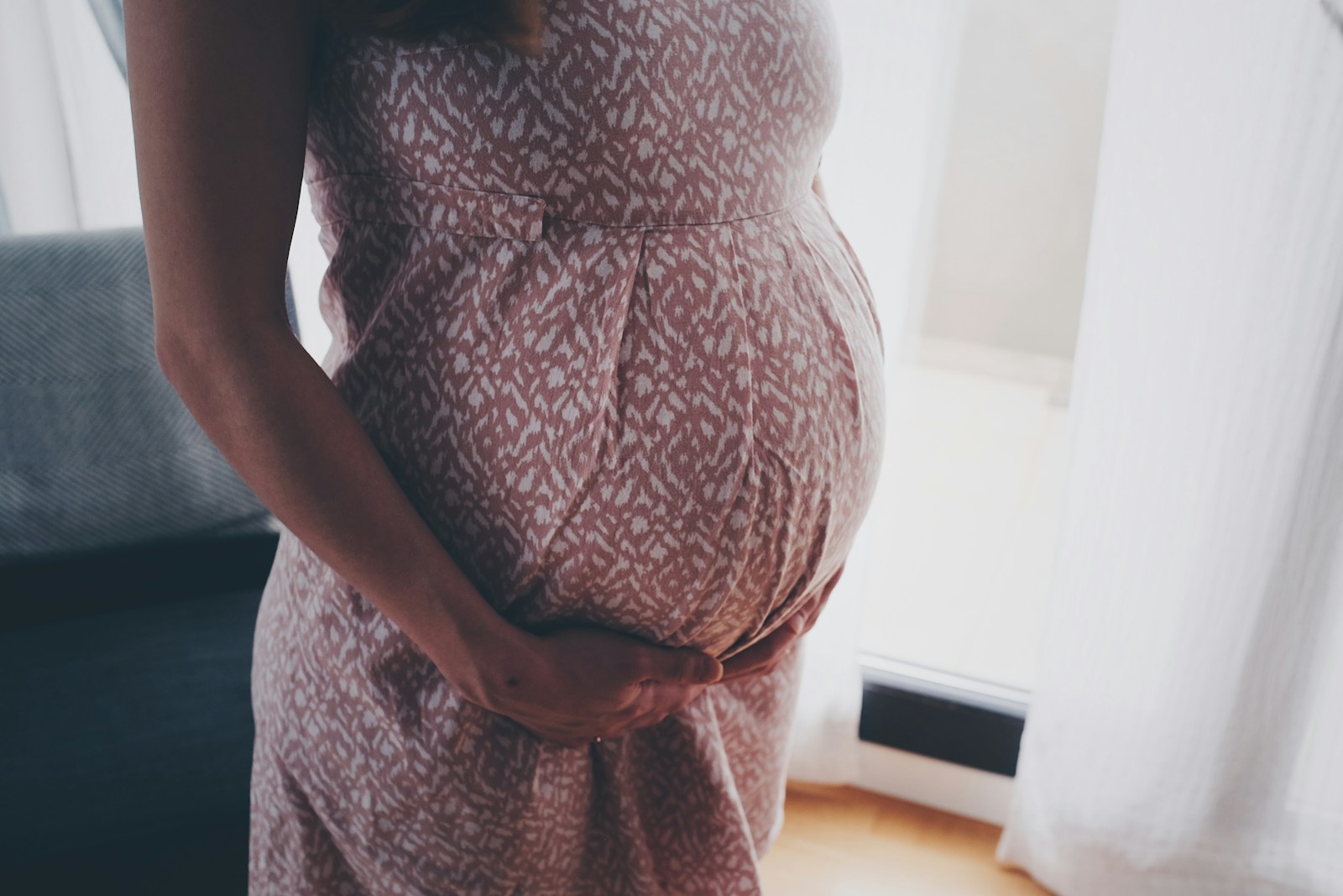 Why am I depressed during pregnancy? 1 woman in brown and white floral dress standing
