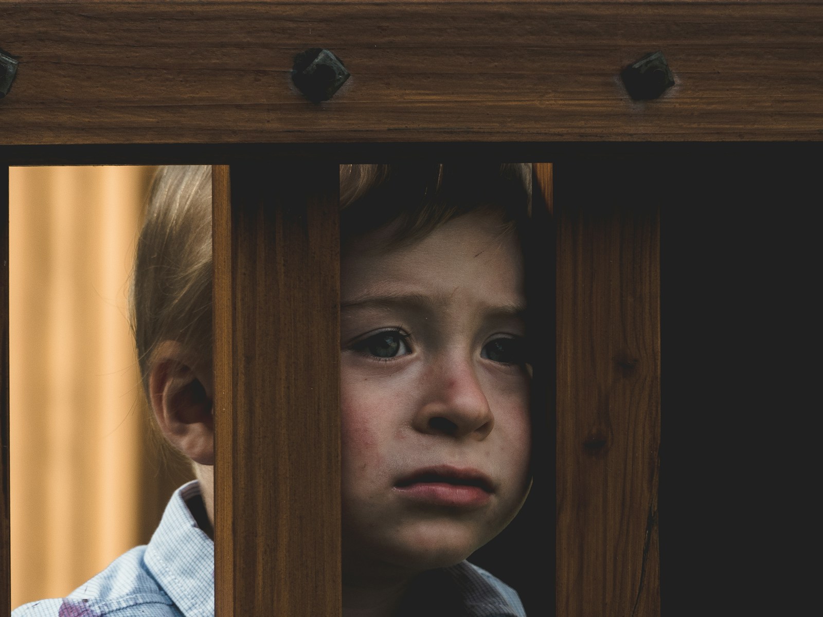 Strategies to Help Your Child Deal With Disappointment and Setbacks 1 boy leaning on brown wooden railings