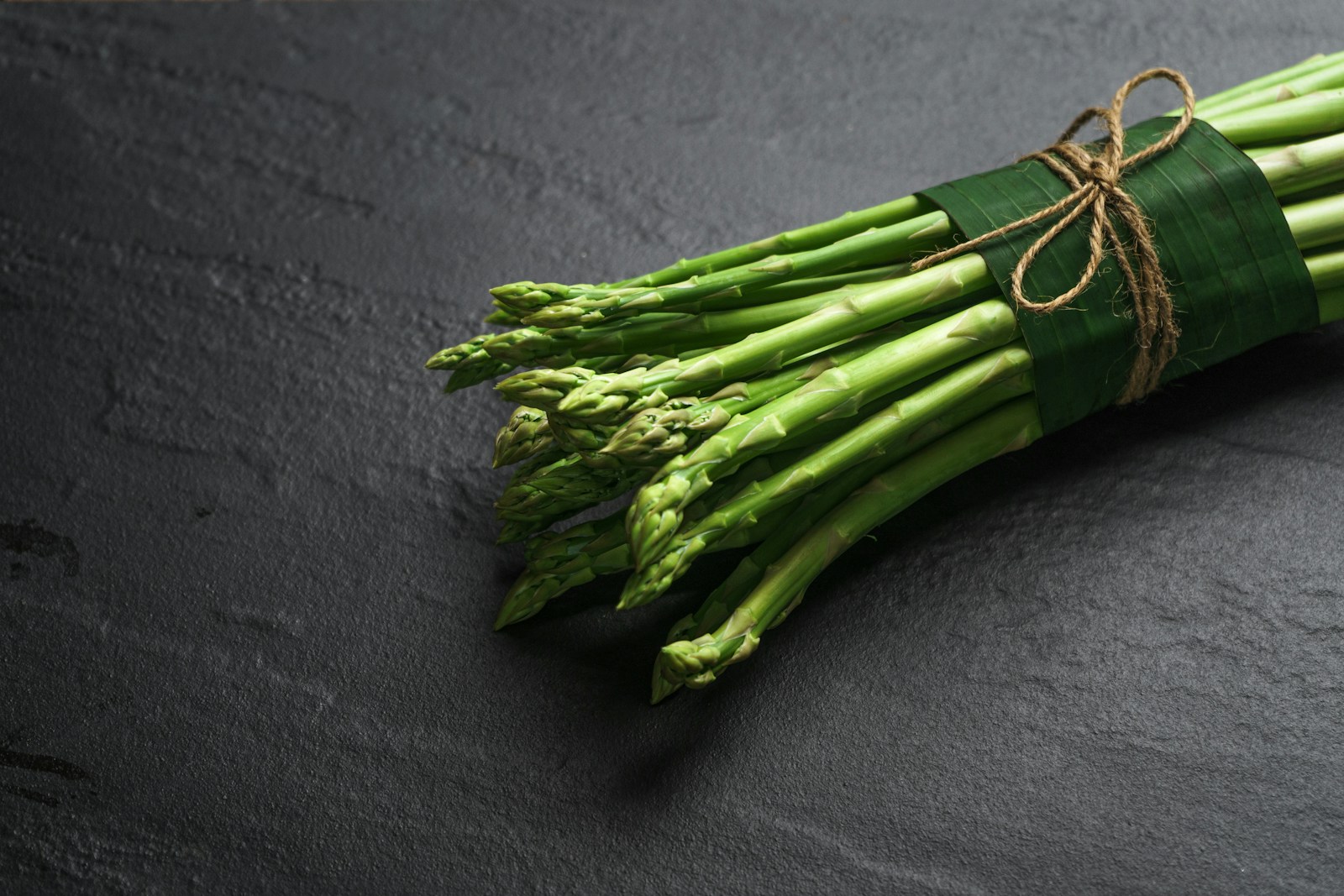 15 Reasons Why You Should Eat More Asparagus 1 green vegetable on black textile