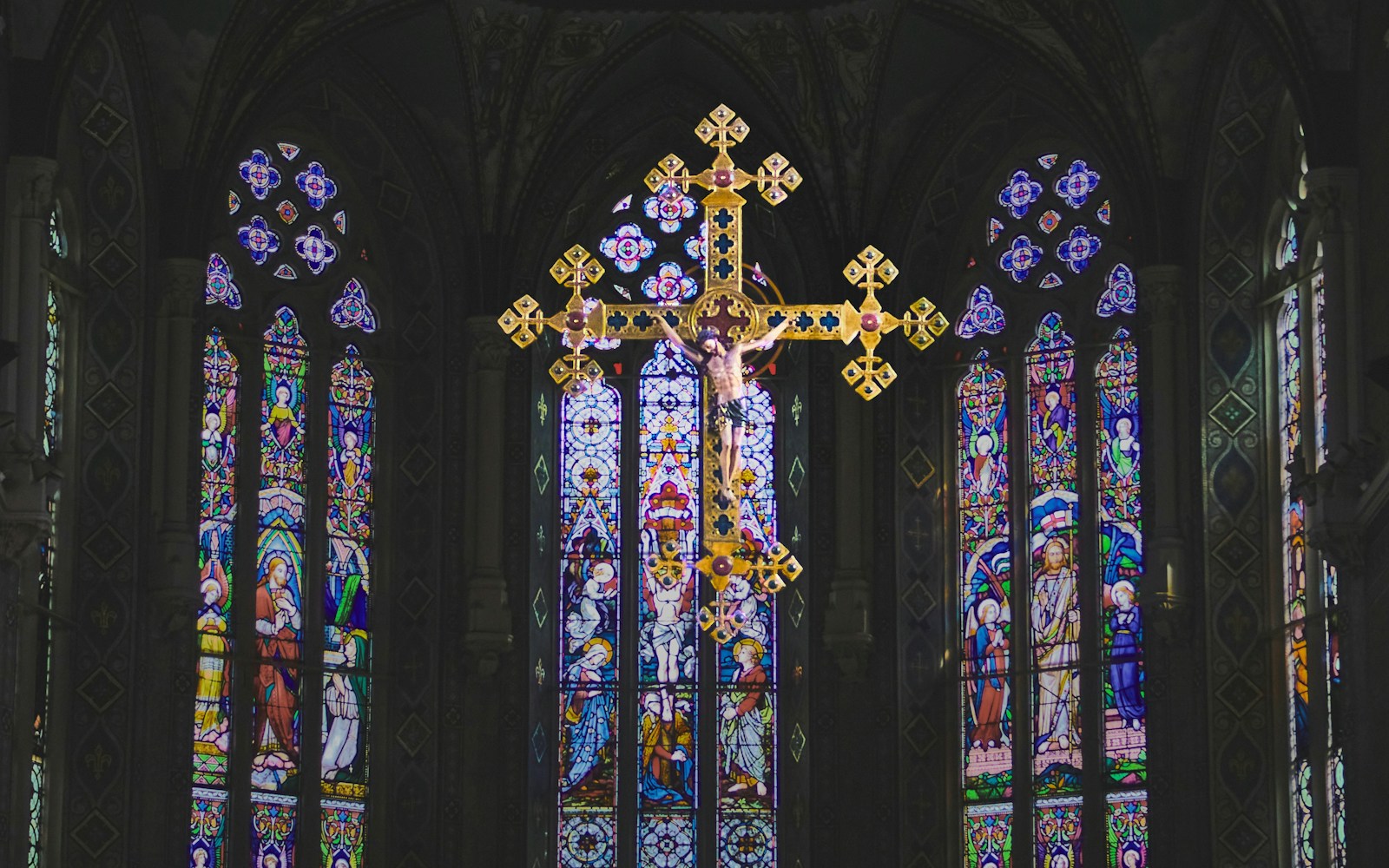 What are the primary differences between Christianity and Catholicism? 1 blue green and yellow floral glass