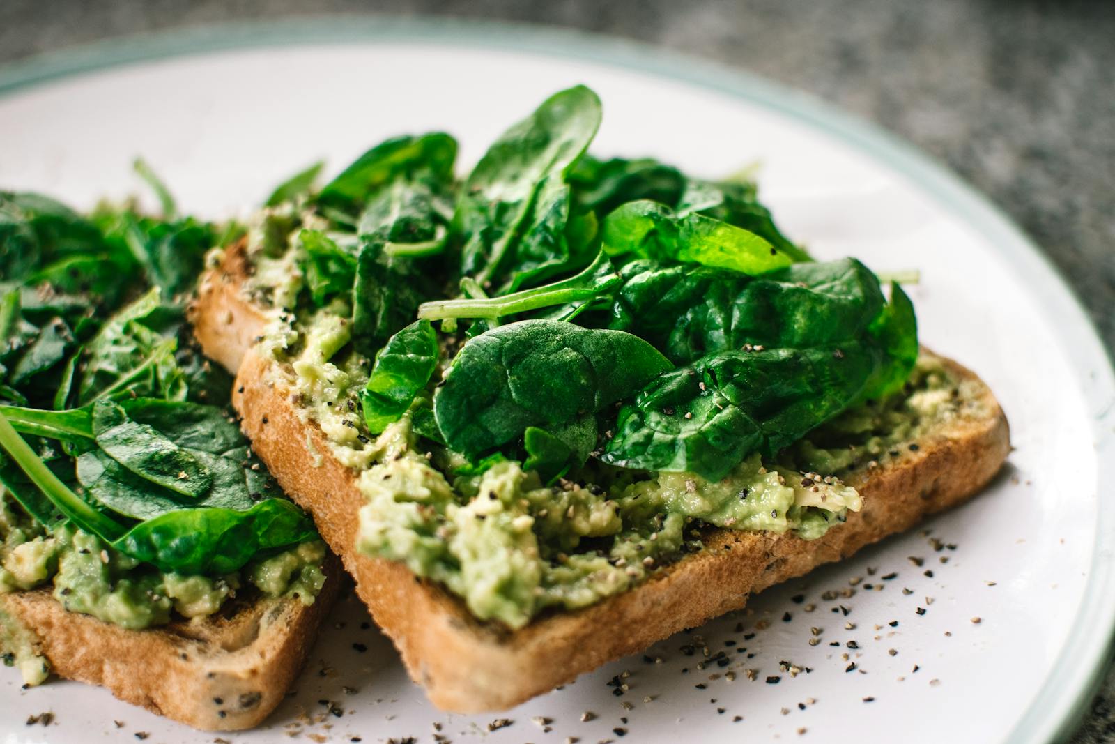 Pros and cons of plant-based diets for cholesterol levels 1 Basil Leaves and Avocado on Sliced Bread on White Ceramic Plate