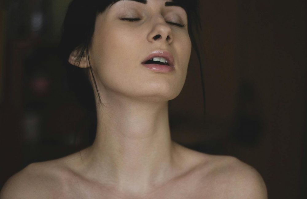 Topless Woman Closing Her Eyes