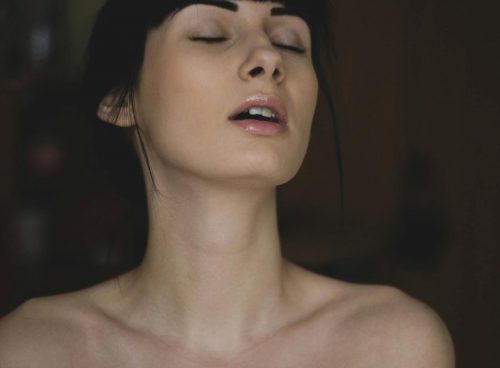 Topless Woman Closing Her Eyes