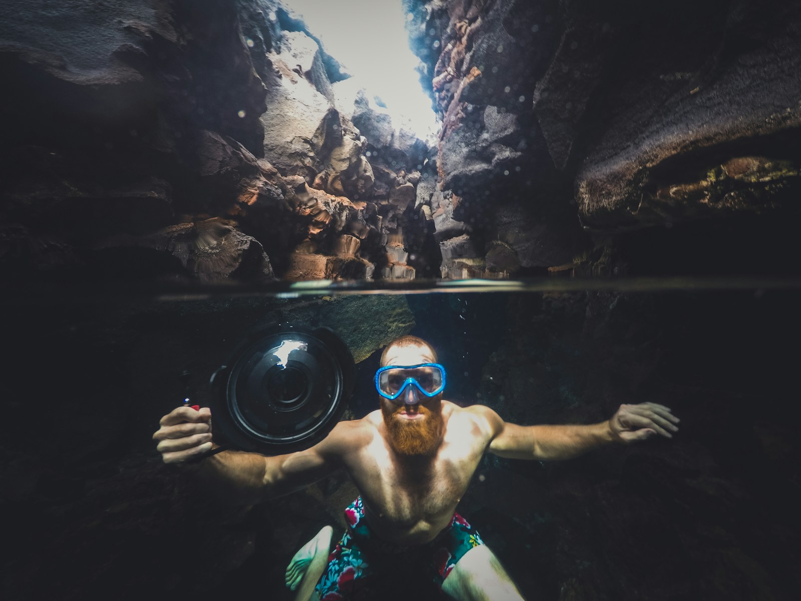 Top 10 Destinations for Underwater Photography Enthusiasts 1 man in body of water between cliffs during daytime