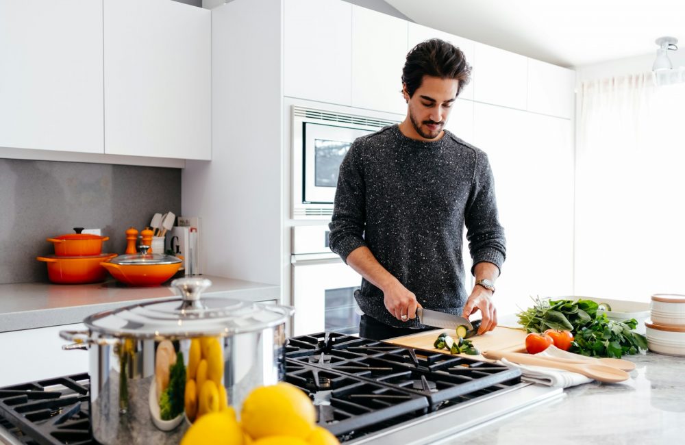 man cutting vegetables