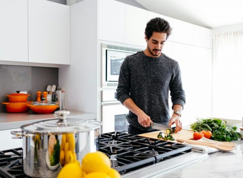man cutting vegetables