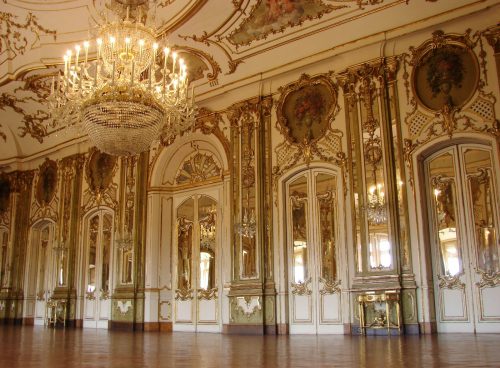 lighted chandelier inside white and brown building