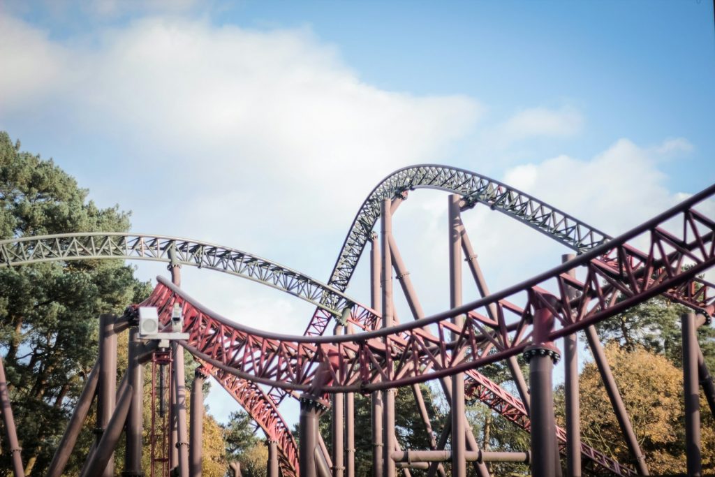 14 Best Places to Visit for Theme Parks 13 a roller coaster going down a hill on a cloudy day