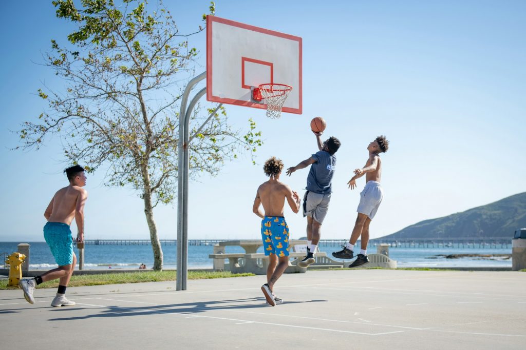 15 Sports and Exercises that Promote Height Growth in Teenagers 2 2 women playing basketball during daytime
