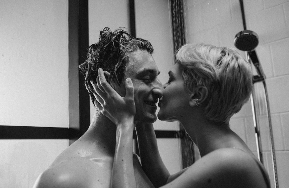 Grayscale Photo of a Romantic Couple Kissing