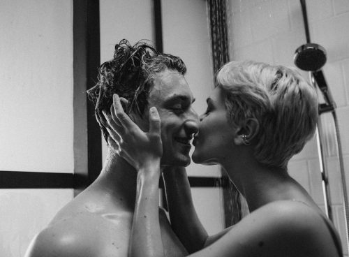 Grayscale Photo of a Romantic Couple Kissing