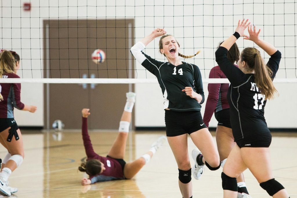 15 Sports and Exercises that Promote Height Growth in Teenagers 3 women playing volleyball inside court