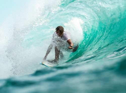 time lapse photography surfer in wave water