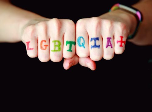 person with blue and red manicure