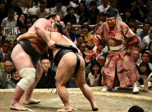 two men in sumo wrestling