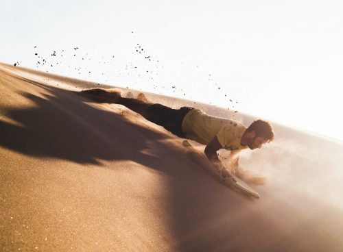 man sliding on deserted place going down