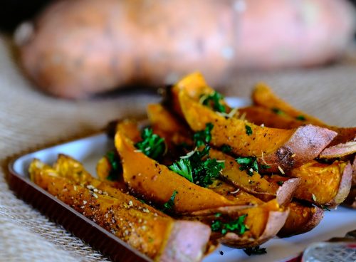 sliced vegetable on brown wooden chopping board