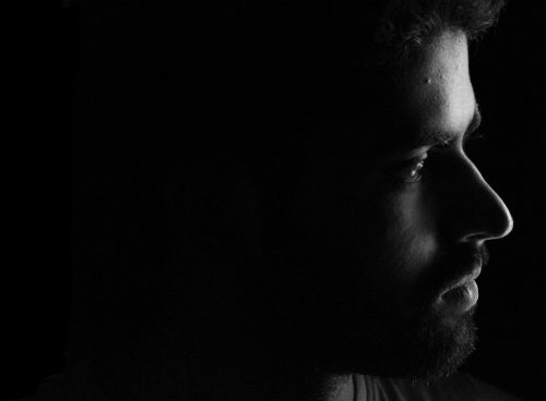 mans face in grayscale