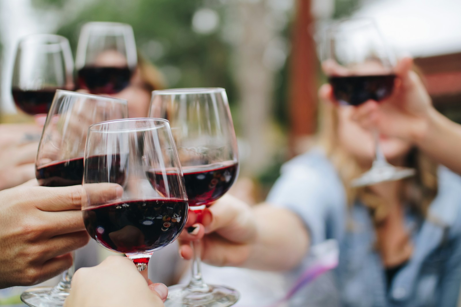 14 Best Places to Visit for Wine Tasting 1 people tossing their clear wine glasses