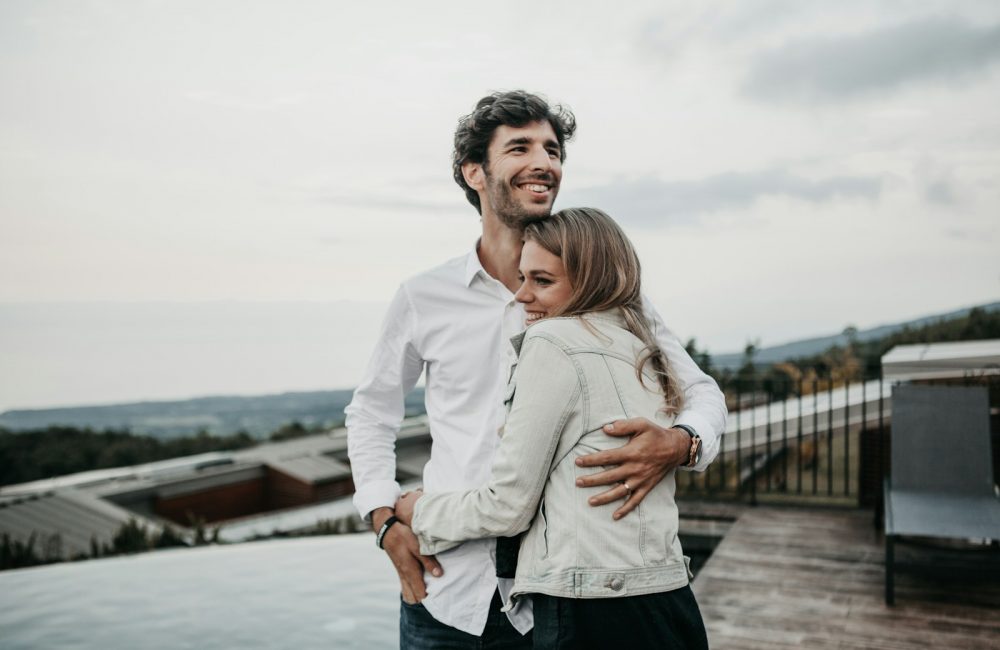 man and woman hugging each other