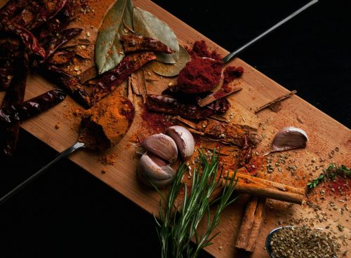 sliced food additives on brown cutting board