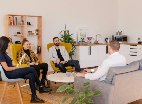 people seated in living room