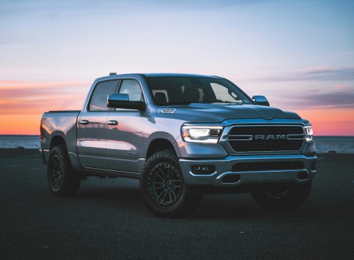 a silver ram truck parked in a parking lot
