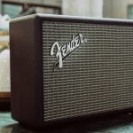 Why does feedback occur when speaker and microphone get close to each other?