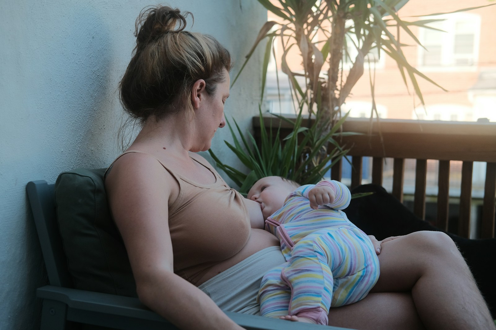 Is it safe to drink coffee during breastfeeding? 1 a woman sitting on a bench holding a baby
