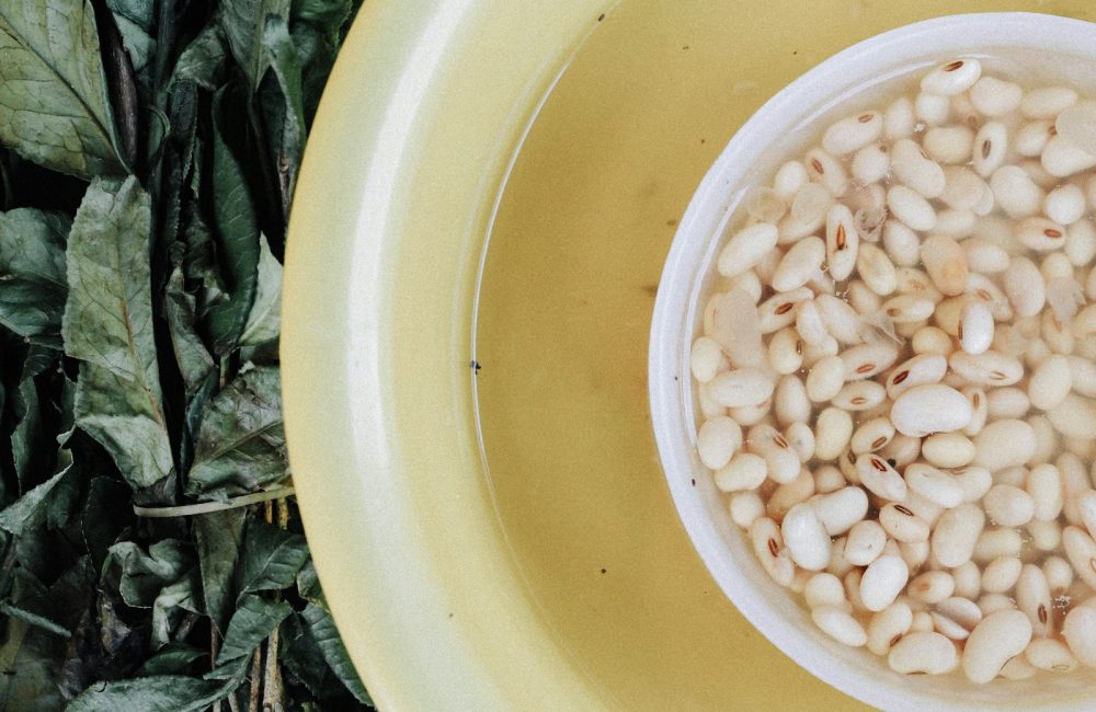white beans in yellow bowl
