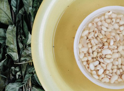 white beans in yellow bowl
