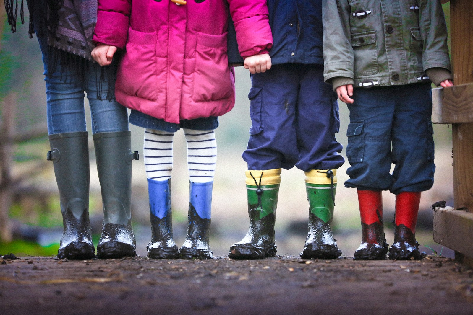 How to Support Your Child Through School Bullying Effectively 1 four children standing on dirt during daytime