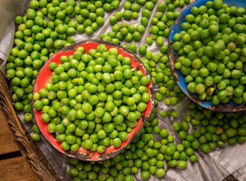 a group of baskets full of green grapes