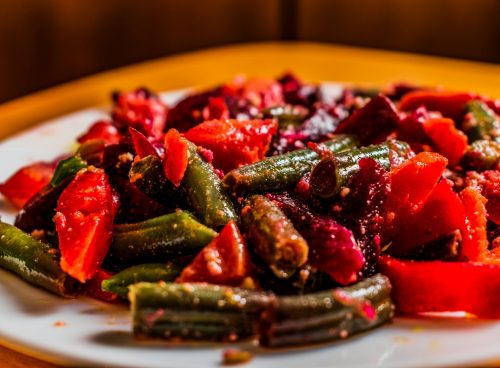 a white plate topped with sliced up vegetables