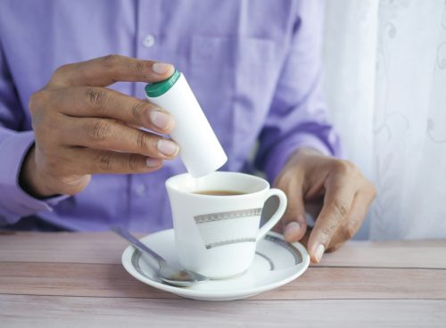 person holding white ceramic mug