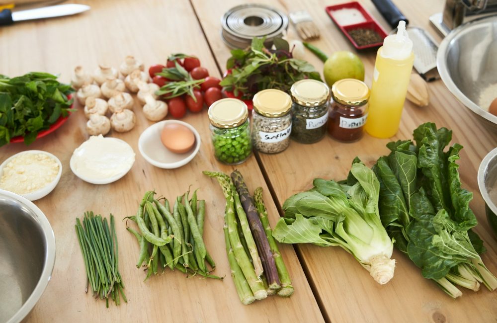 green vegetable on brown wooden table
