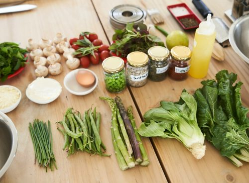 green vegetable on brown wooden table