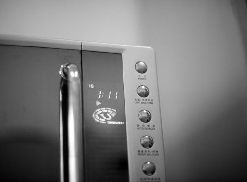 a black and white photo of a microwave