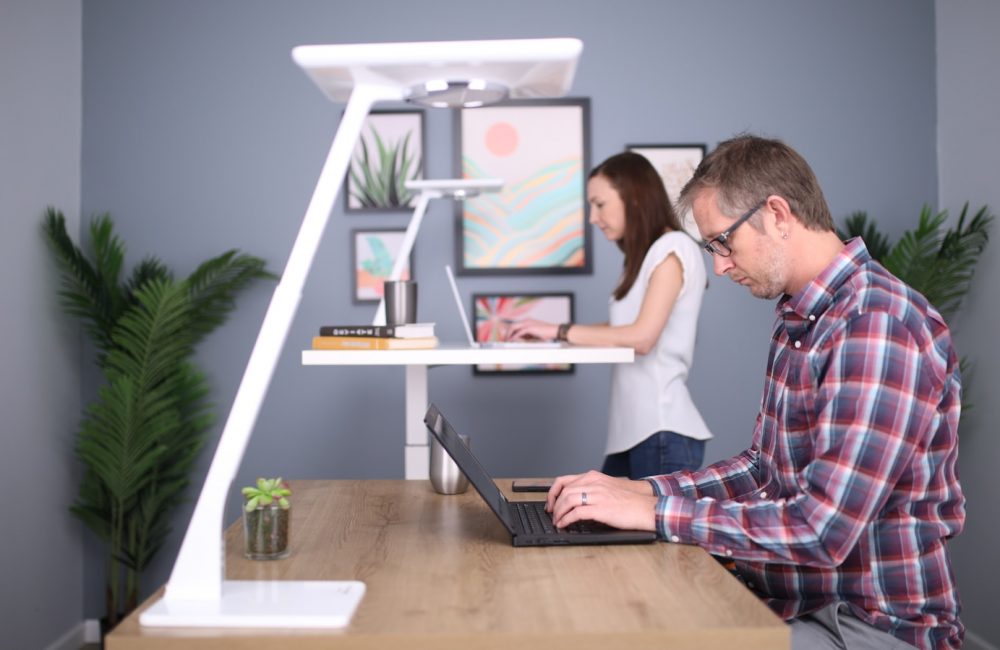 man in white crew neck t-shirt using black laptop computer
