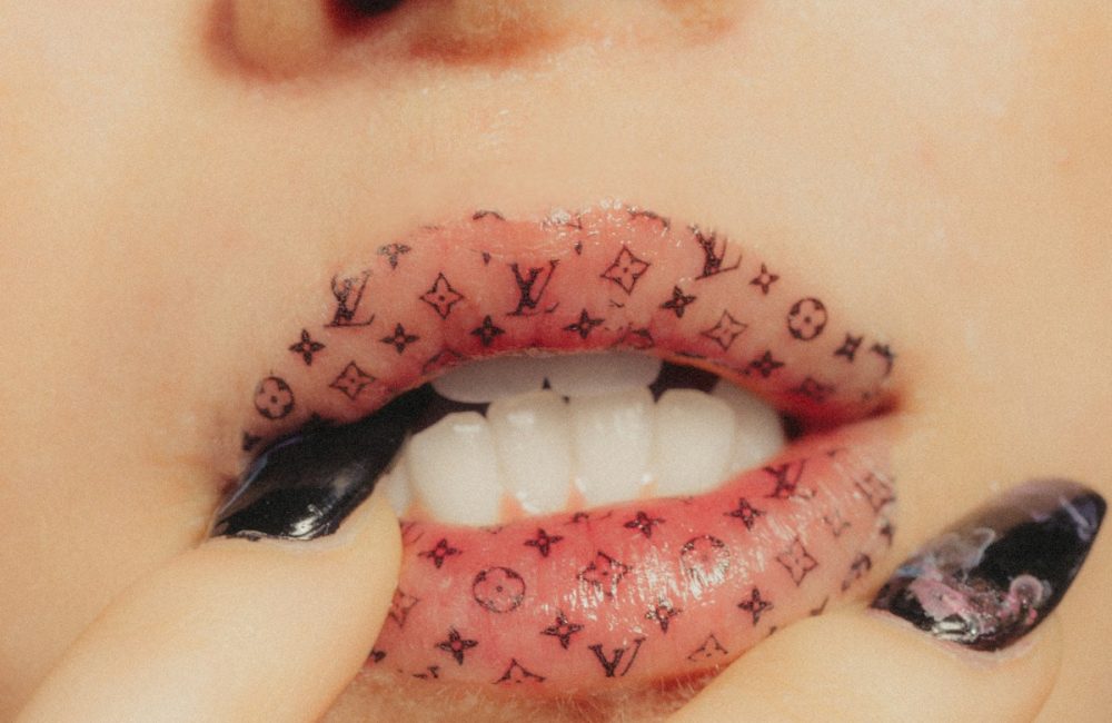 woman wearing Louis Vuitton lipstick