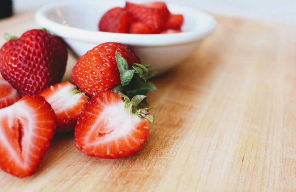 Photo of Strawberries in Bowl on Table.